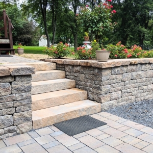 Belgard Brookshire stone-texture retaining wall with precast concrete steps and a paver driveway in New Paltz, NY, designed by Ulster County Landscapers Masseo Landscape, Inc.