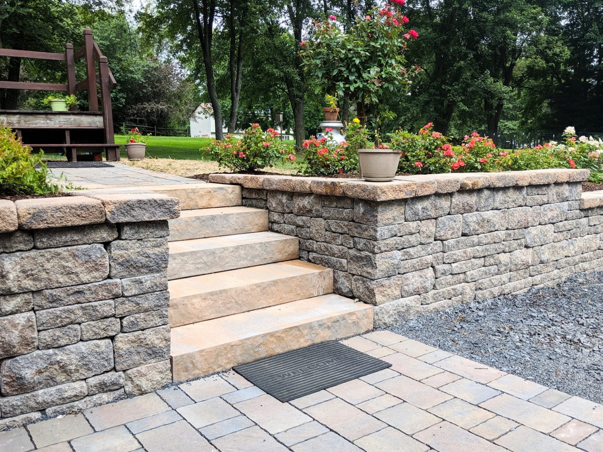 Retaining wall with stone steps and patio