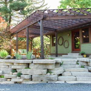A tiered retaining wall and natural stone patio and outdoor living area, designed and installed by Masseo Landscape, Inc., Ulster County Landscapers