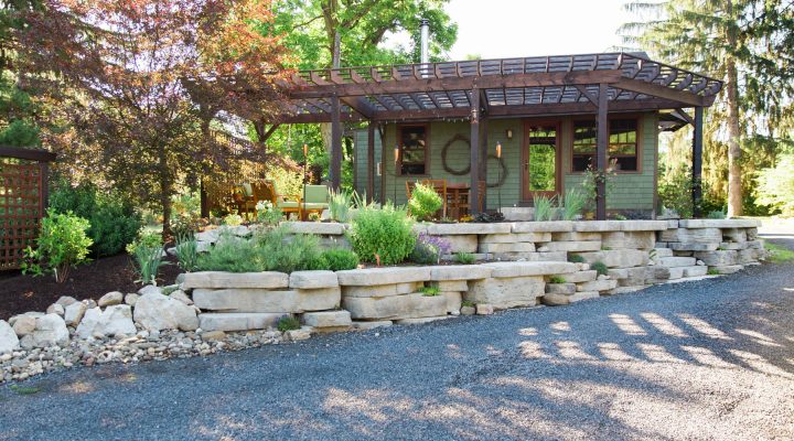 A tiered retaining wall and natural stone patio and outdoor living area, designed and installed by Masseo Landscape, Inc., Ulster County Landscapers