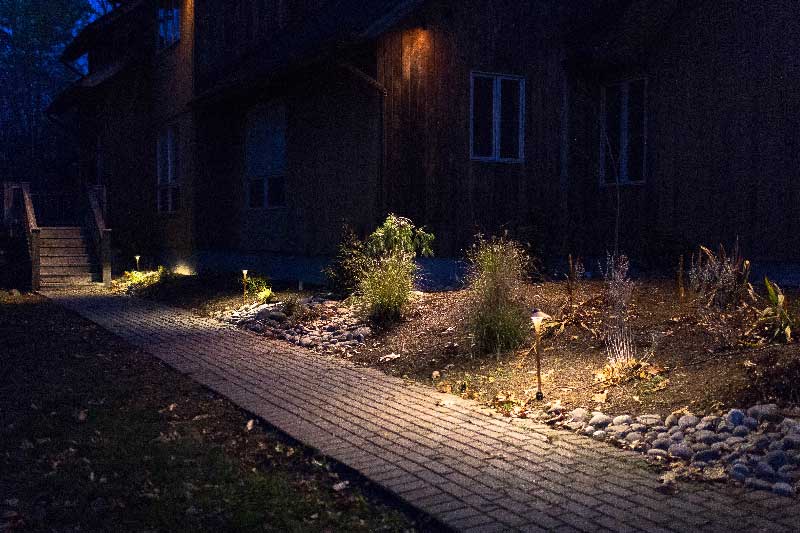 Landscaping lighting along paver pathway and in front garden beds in Ulster County, NY installed by New Paltz Landscaper Masseo Landscape, Inc.