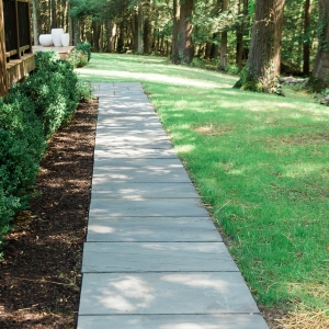 Geometric bluestone walkway with boxwood hedge installed by Masseo Landscape, Inc. in Ulster County, NY