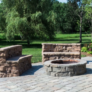 Rosetta wallstone repurposed as built-in seating around a round fire pit, designed and custom-built by Masseo Landscape, Inc.