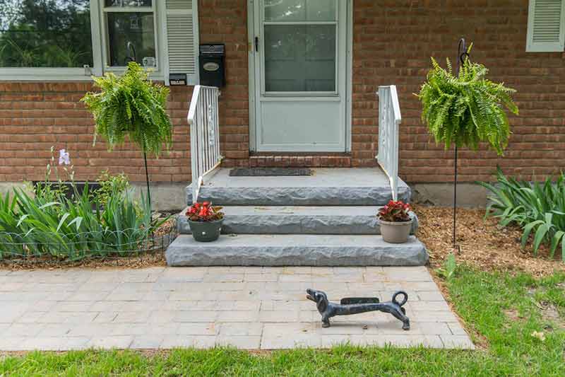 Stone steps and a paver walkway. 