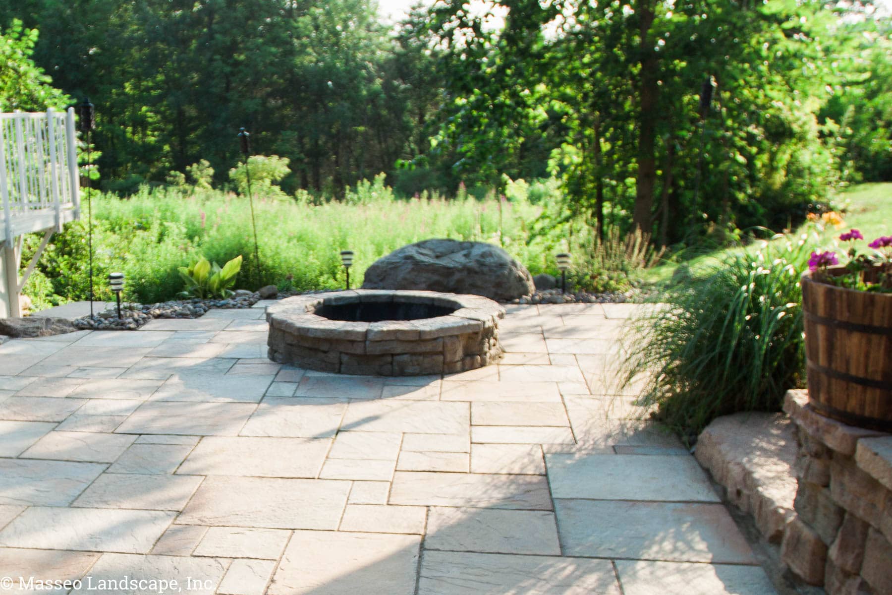 Rosetta round fire pit and patio designed and installed by Masseo Landscape, Inc, best New Paltz Landscaping Company